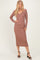 woman wearing a taupe long sleeve ribbed midi dress with a v-neck and high side slits