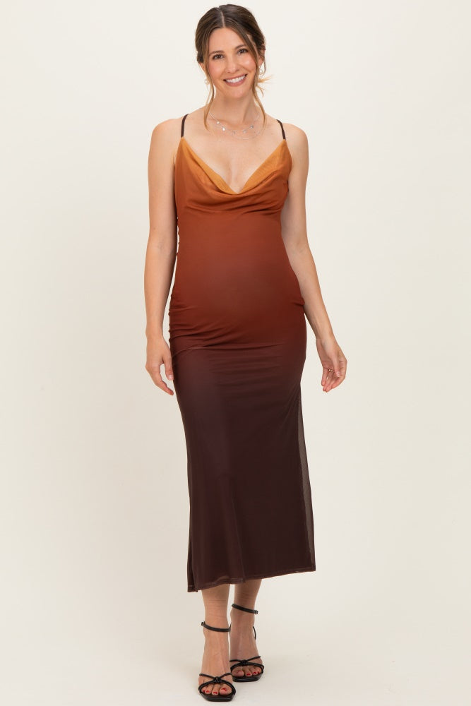 woman wearing a maternity ombre maxi dress in shades of orange and brown with a cowl neckline and spaghetti straps