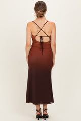 woman wearing a brown ombre maternity dress with a crisscross back and adjustable tie details