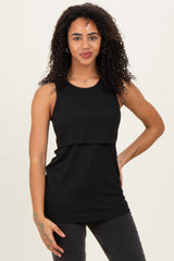 woman wearing a black sleeveless ribbed top with a layered design