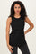 woman wearing a black sleeveless ribbed top with a layered design