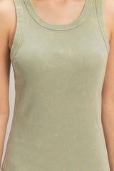 woman wearing a light green ribbed tank top with a scoop neckline