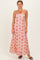 woman wearing a red and white floral maxi dress with spaghetti straps and a fitted bodice