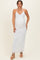 woman wearing a white halter neck maxi maternity dress showing her baby bump