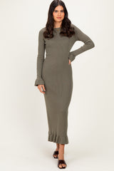woman wearing an olive green ribbed long sleeve knit dress with ruffle hem and bell sleeves