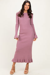 woman wearing a dusty mauve long sleeve ribbed knit maxi dress with ruffle hem and flared sleeves