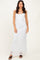 woman wearing a white lace maxi dress with adjustable straps and a fitted silhouette