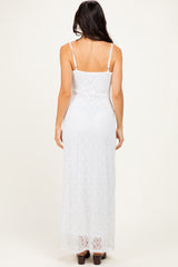 woman wearing a white lace maxi dress with thin straps and a fitted silhouette from the back