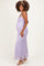 woman wearing a lavender lace maternity maxi dress, showing off her baby bump