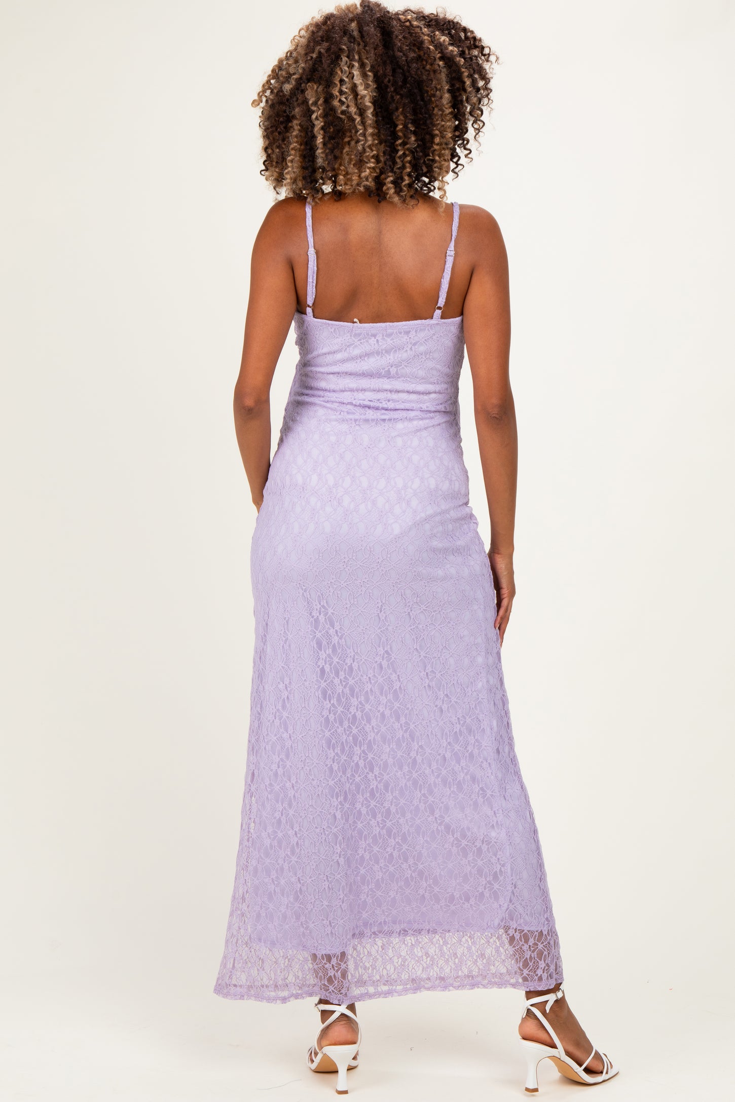 woman wearing a lavender lace maternity maxi dress with adjustable spaghetti straps from the back