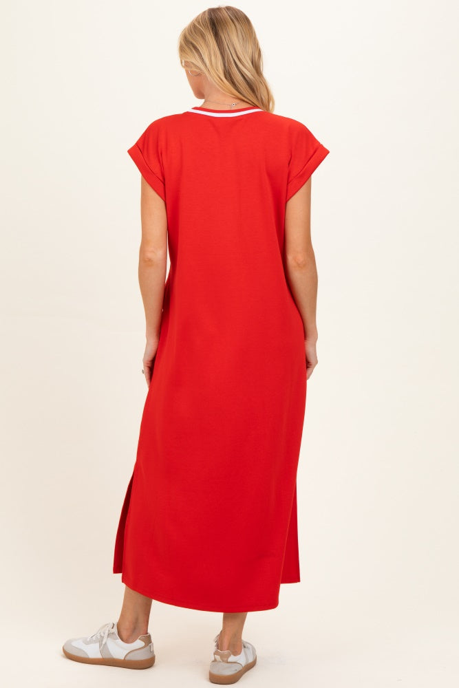 woman wearing a red maternity maxi dress with short sleeves and side slits, showing a relaxed fit