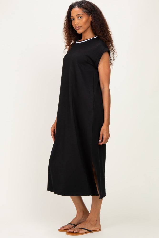 woman wearing a black sleeveless maxi dress with side slits and a white neckline detail
