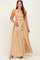 woman wearing a brown and cream striped maternity maxi dress with an elastic waist and ruffled shoulder detail