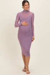 woman wearing a light purple long sleeve maternity dress with a high neck and baby bump visible