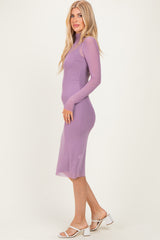 woman wearing a lavender long sleeve bodycon dress with a sheer overlay and heeled sandals