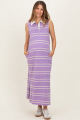 woman wearing a purple striped maternity maxi dress with a collar and pockets, showing her baby bump