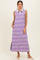 woman wearing a lavender striped sleeveless maxi dress with a white collar and side slits