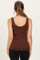 woman wearing a brown maternity tank top viewed from the back