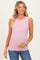 woman wearing a light pink ribbed maternity tank top and holding her baby bump