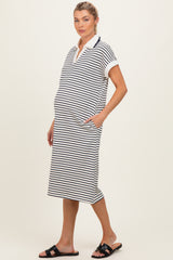 woman wearing a striped maternity polo dress with short sleeves and side pockets, showcasing her baby bump