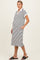woman wearing a striped maternity polo dress with short sleeves and side pockets, showcasing her baby bump