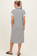 woman wearing a black and white striped maternity dress with short sleeves, shown from the back