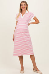 woman wearing a pink and white striped maternity polo dress with a collar and short sleeves, showcasing her baby bump