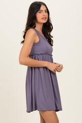 woman wearing a sleeveless lavender ribbed dress with a fitted bodice and flared skirt