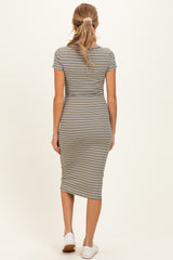 woman wearing a fitted striped maternity dress with short sleeves, viewed from the back