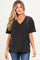 woman wearing a black oversized v-neck maternity t-shirt with short sleeves and a loose fit