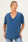 woman wearing a blue v-neck maternity tee with rolled short sleeves and a relaxed fit, revealing her baby bump
