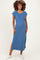 woman wearing a blue maternity maxi dress with short sleeves and side slits, displaying a visible baby bump