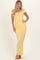 woman wearing a pale yellow off-shoulder ruched maxi dress with a decorative neckline and a fitted silhouette
