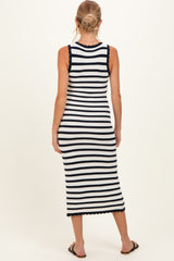 woman wearing a navy and white striped maternity tank dress with a fitted silhouette and back scallop detailing
