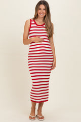 woman wearing a red and white striped maternity dress with a fitted silhouette and holding her baby bump