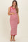 woman wearing a red and white striped maternity dress with a fitted silhouette and holding her baby bump