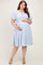 woman wearing a light blue off-the-shoulder maternity dress with puff sleeves and a visible baby bump