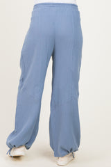 maternity wide leg pants in light blue with a textured finish and an elastic waistband, model seen from the back
