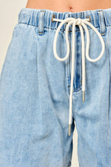light blue denim shorts with an elastic waistband and drawstring detail