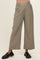 woman wearing a pair of beige maternity wide-leg trousers with an elastic waistband and black loafers