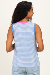 woman wearing a striped blue maternity tank top with a pink neckline, showing her back and styled with light blue jeans