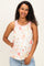 woman wearing a floral maternity tank top with light pink trim and a visible baby bump