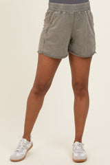 woman wearing light gray maternity shorts with an elastic waistband and a relaxed fit