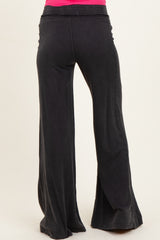 maternity wear black wide-leg pants with an elastic waistband, model shown from the back