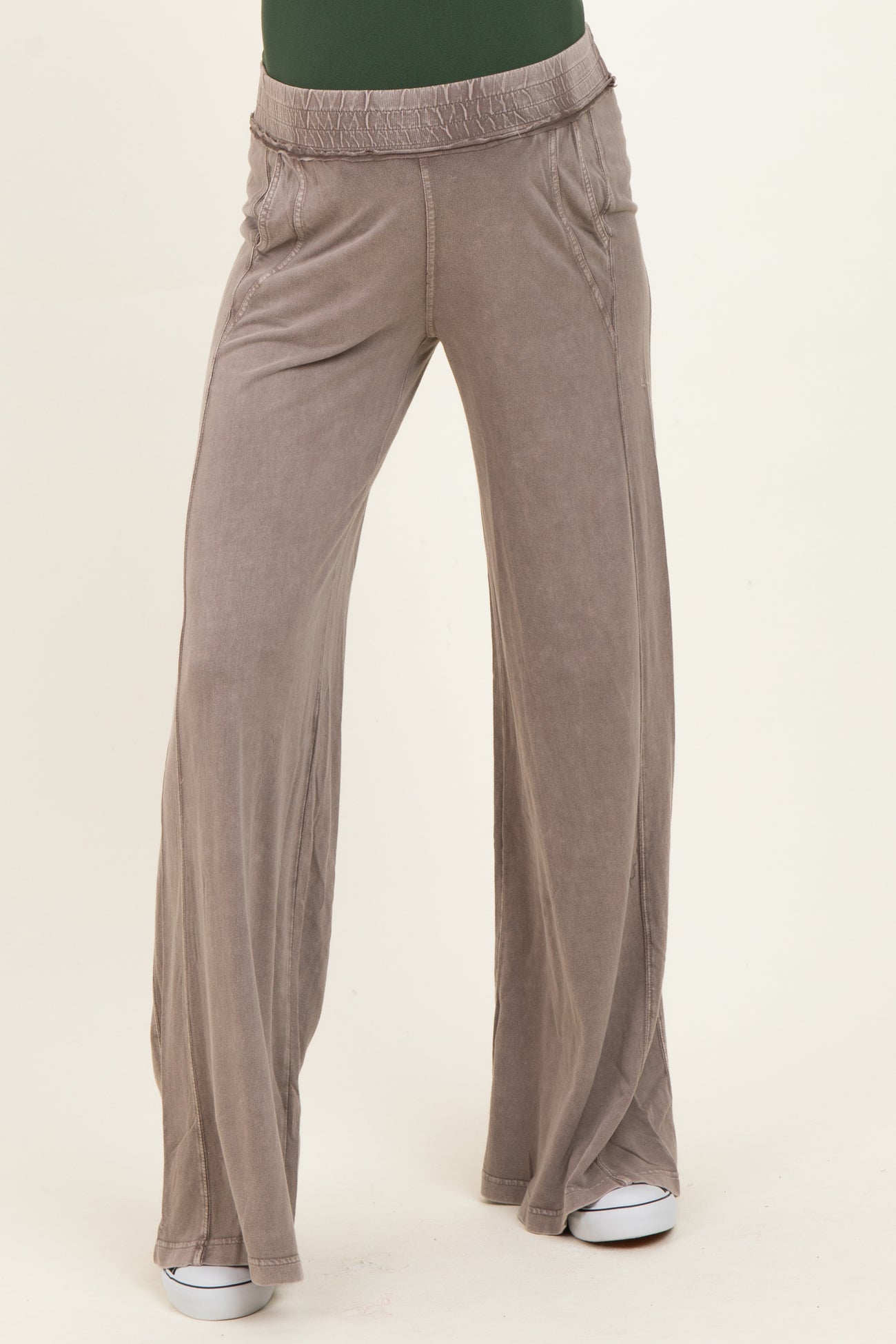 maternity wear in light gray wide-leg pants with an elastic waistband, model standing with a relaxed fit