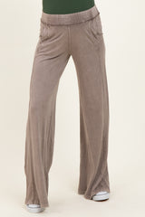 maternity wear in light gray wide-leg pants with an elastic waistband, model standing with a relaxed fit