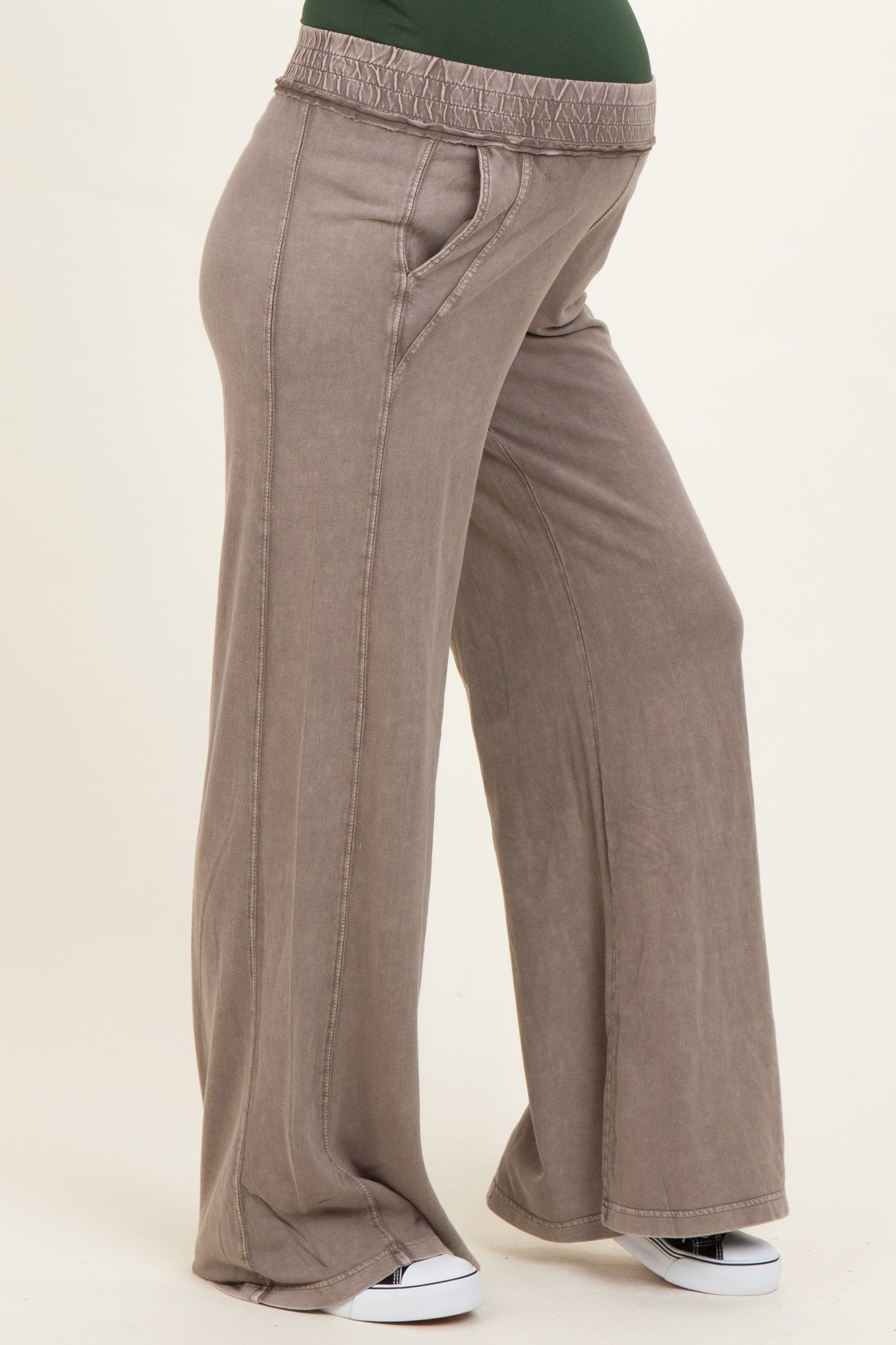 woman wearing taupe maternity wide-leg pants with a stretchy waistband and side pockets
