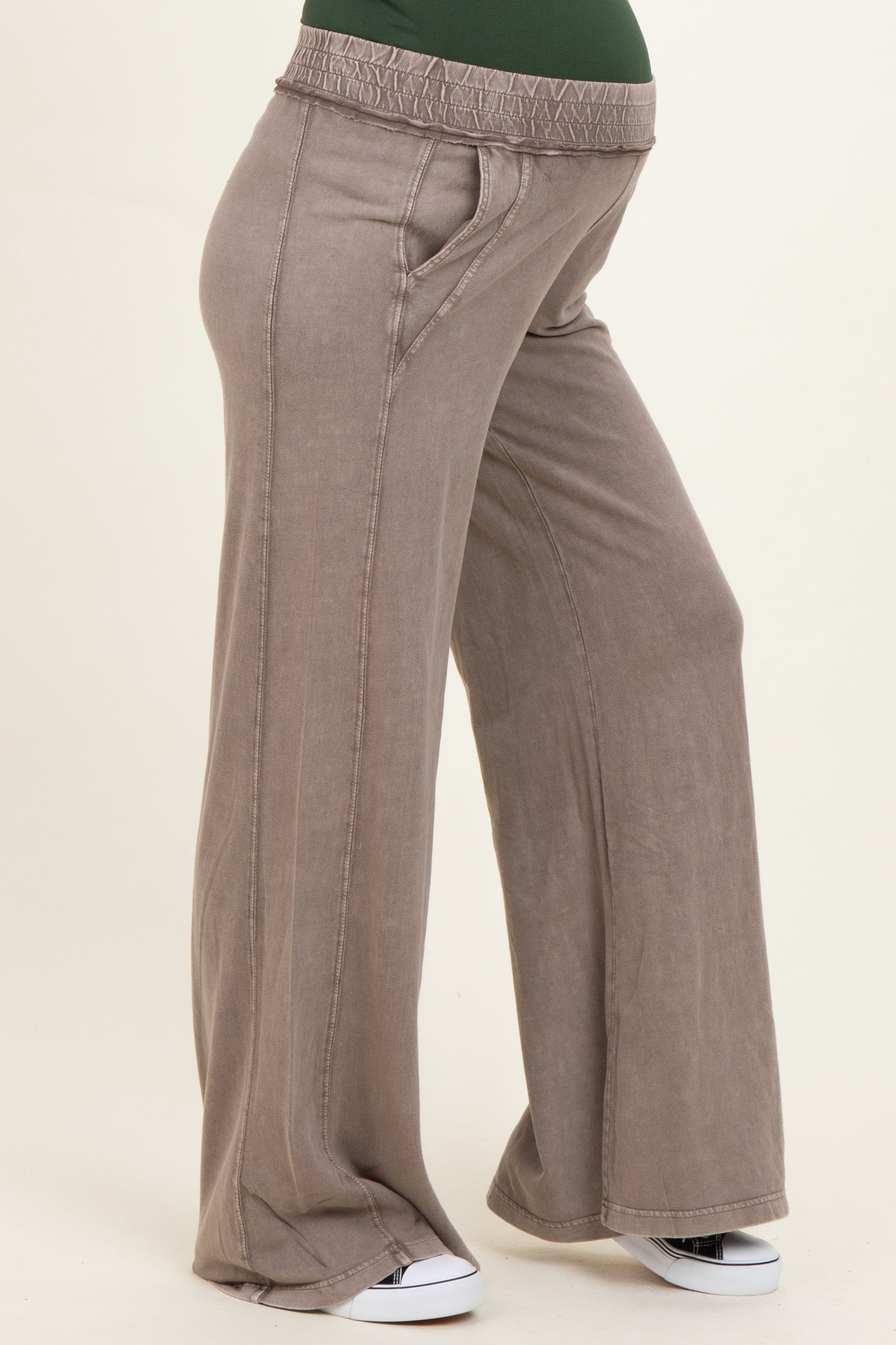 woman wearing taupe maternity wide-leg pants with a stretchy waistband and side pockets