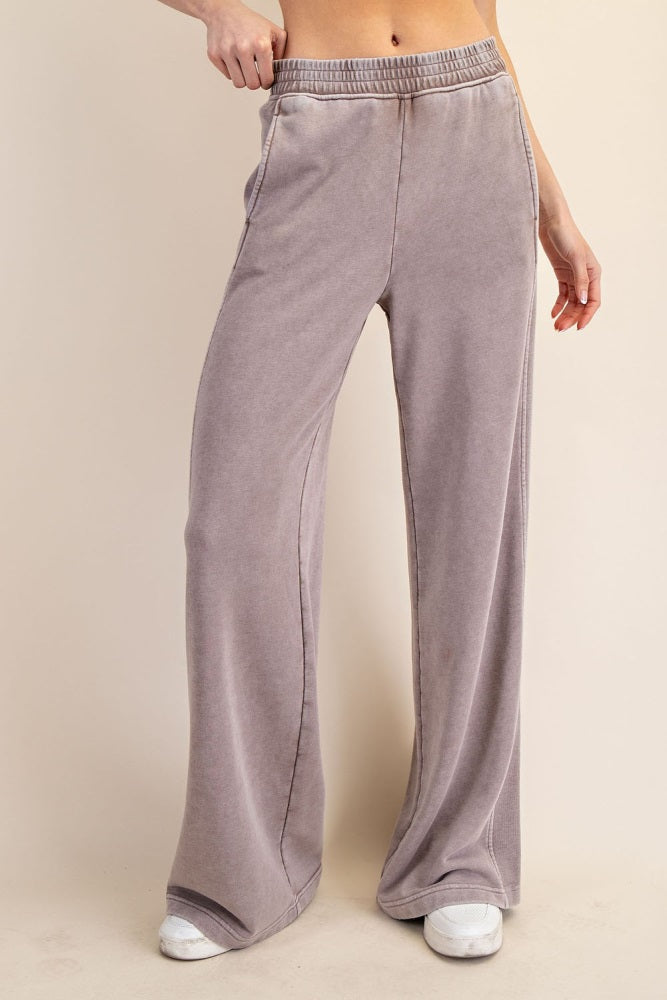 woman wearing light purple high-waisted wide-leg lounge pants with an elastic waistband