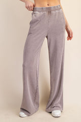 woman wearing light purple high-waisted wide-leg lounge pants with an elastic waistband